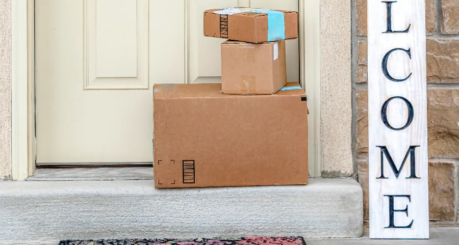 Deliveries on the front porch of a house with a welcome sign in Elizabethtown